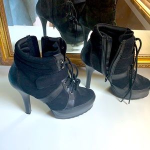 Jennifer Lopez high heeled black ankle boots
